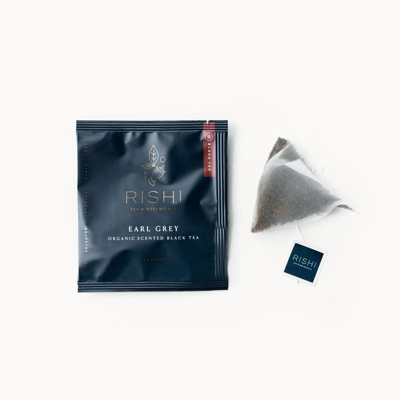 A bag of Earl Grey tea next to a bag of Rishi Tea & Botanicals.