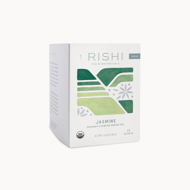 A box of Rishi Tea & Botanicals Jasmine Green, containing 15 sachets, created in collaboration with the Xuan En Yisheng Tea Cooperative. The packaging features green abstract shapes on a white background, symbolizing the high mountain origins of its exquisite Jasmine Green tea leaves.