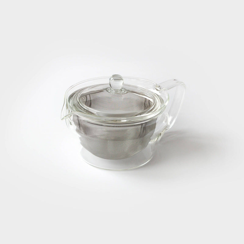 A Hario North America, LLC zen glass teapot with a sleek metal infuser and transparent lid is elegantly set against a plain white background.