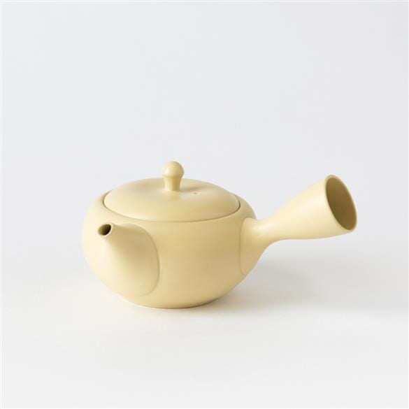 A yellow Kikumaru Tokoname Sasame Kyusu Teapot by Rishi Tea & Botanicals on a white background.